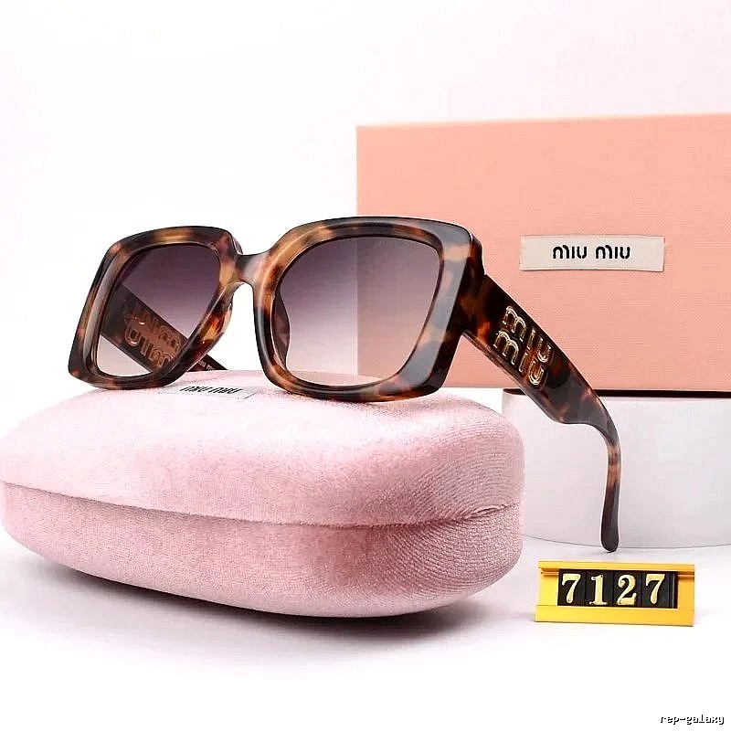 Miu Miu Relaxed Oversized sunglasses Black Oval Sunglasses with Designer-Inspired Detail