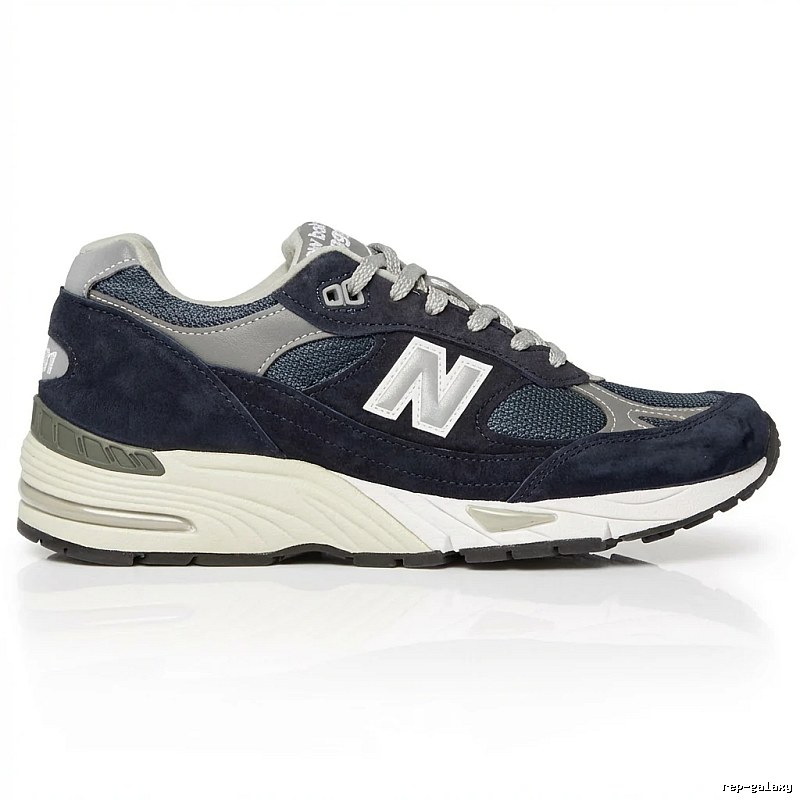 New Balance retro-style dark blue and grey sports shoes